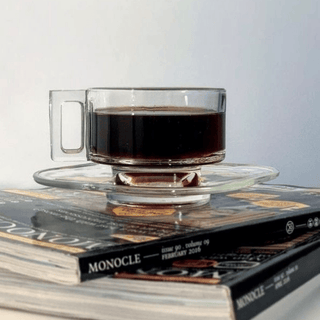 Joe Colombo Arno Teacup and Saucer on a stack of books